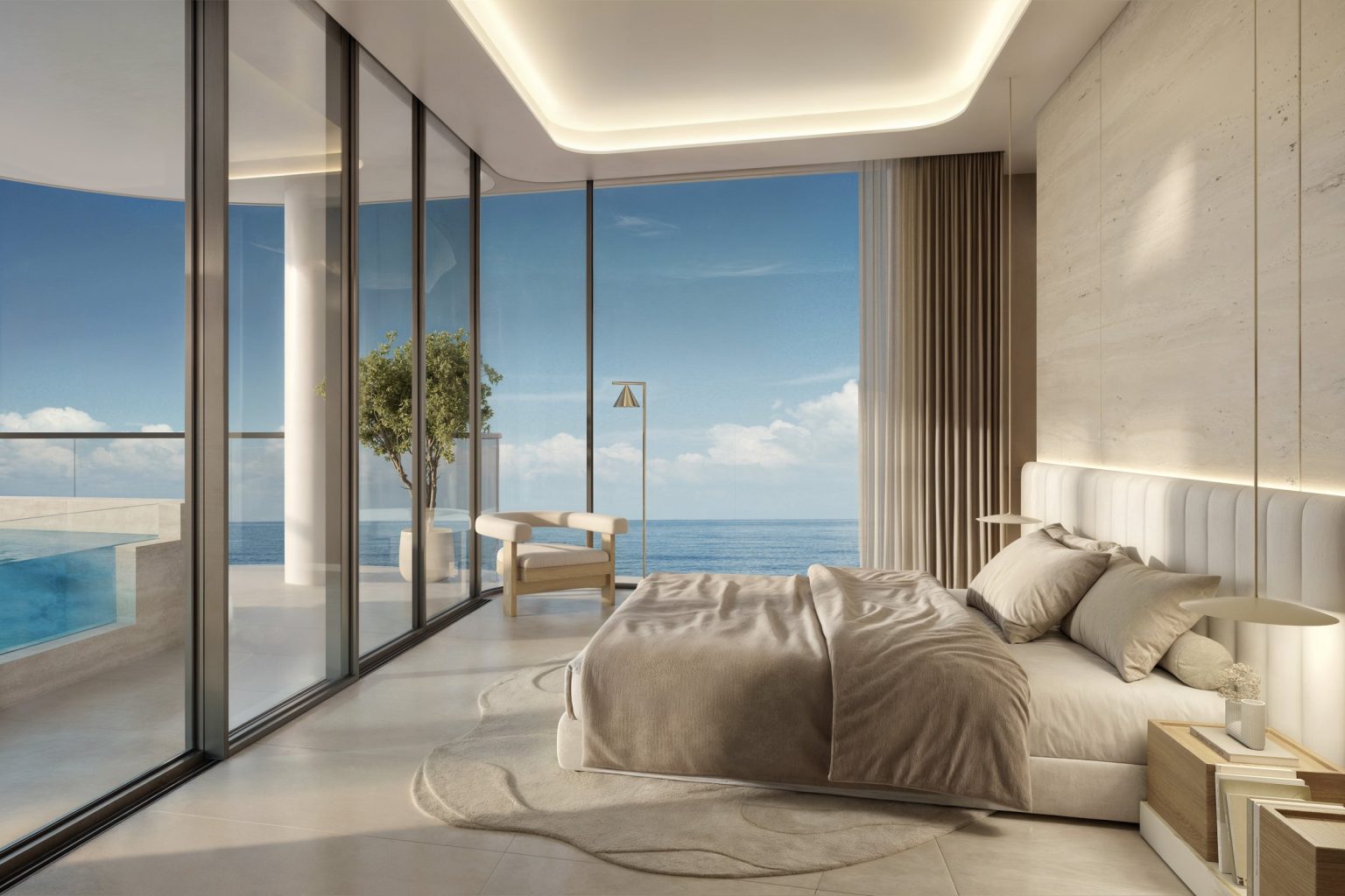 Primary bedroom with floor-to-ceiling sea views at Esmé Beach Residences