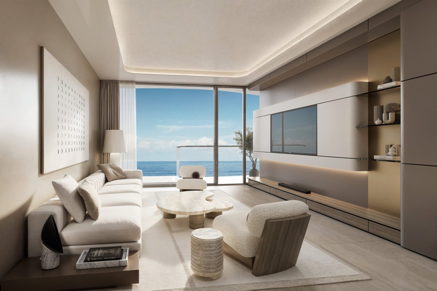 Living room opening onto a private terrace at Esmé Beach Residences