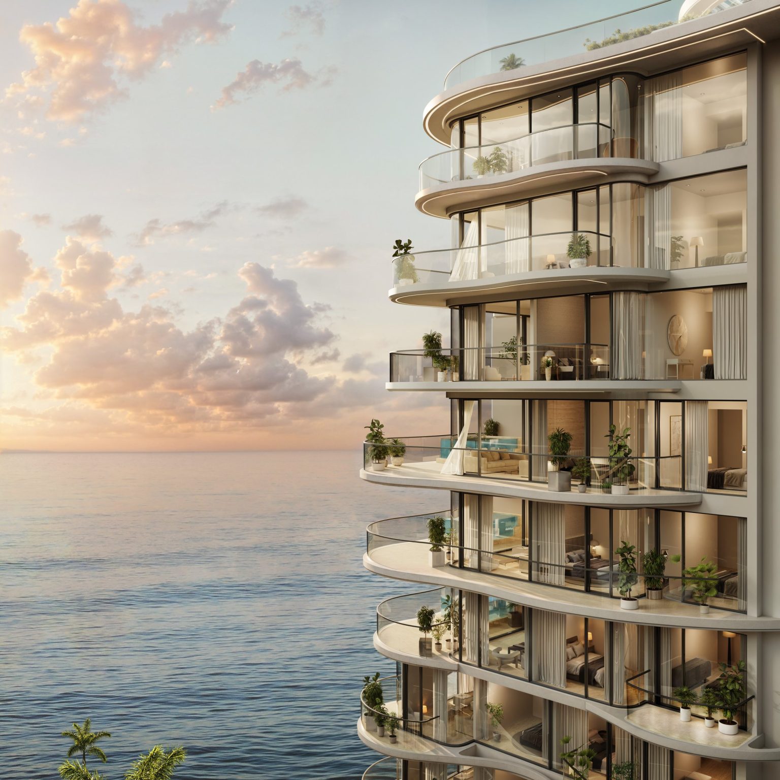 Wavy façade and private terraces of Esmé Beach Residences at sunset